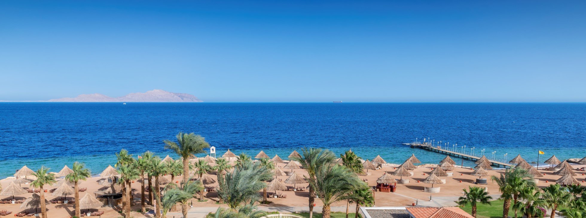 Panoramic view of sunny beach in tropical resort in Red Sea coast in Egypt, Africa