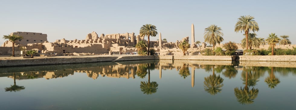 reflection of Karnak Temple outside view in Nile river