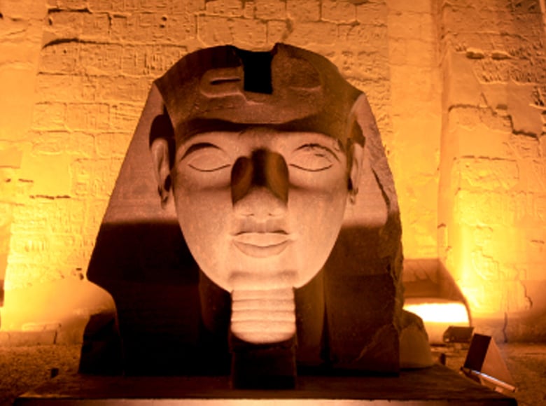 Statue of King Ramses The 2nd Tomb Mask in Luxor Temple night lights
