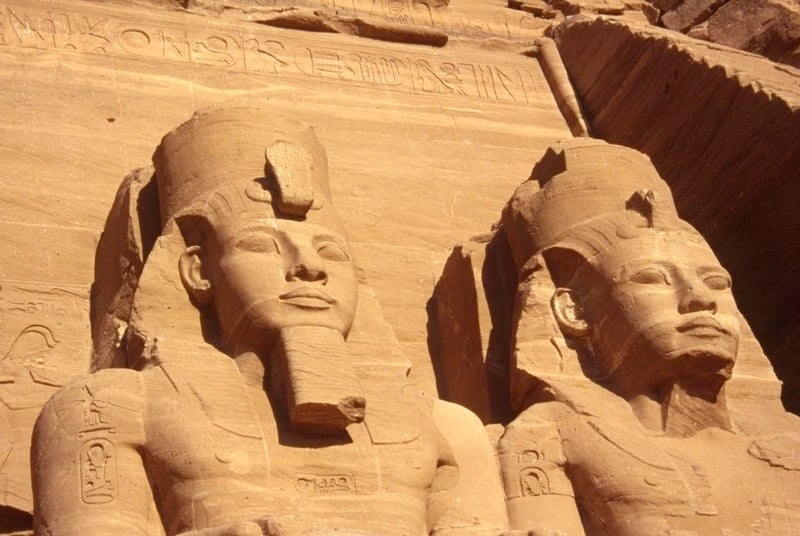 Egyptian statues on the side of a building
