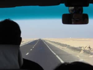 driving on the road through the desert