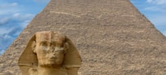 Head of Great Pyramid of Giza with blue sky