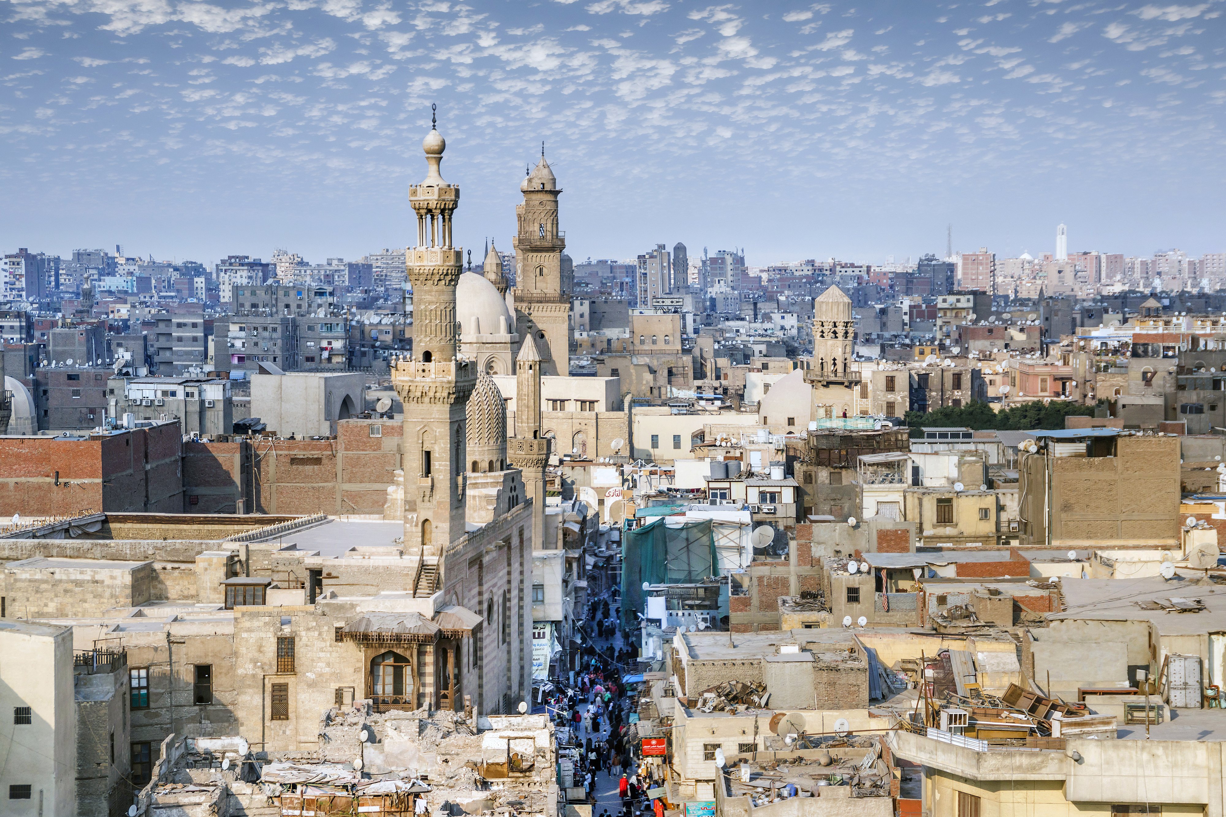 Aerial view of Al-Muizz street of Islamic Cairo with mosques, palaces and residential buildings from the minaret of Sultan Al-Ghuri Mosque-Madrasa, Cairo, Egypt