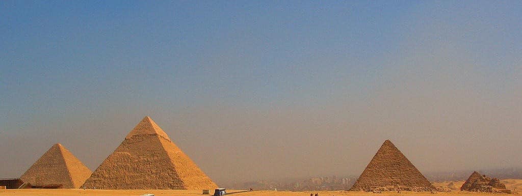 Classic view of the Giza pyramids under a clear blue sky for our holidays blog.