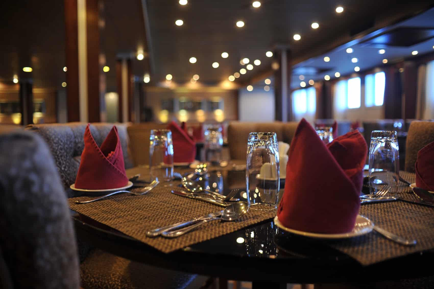 Elegant table in Cairo set with red napkins and glassware.