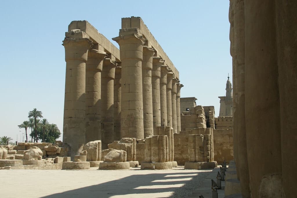 Jewels of the Nile, ancient columns stand under a clear blue sky.