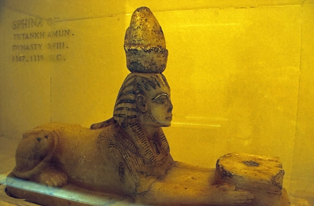 Ancient Egyptian sphinx statue with a headdress, perfect for those visiting Luxor.