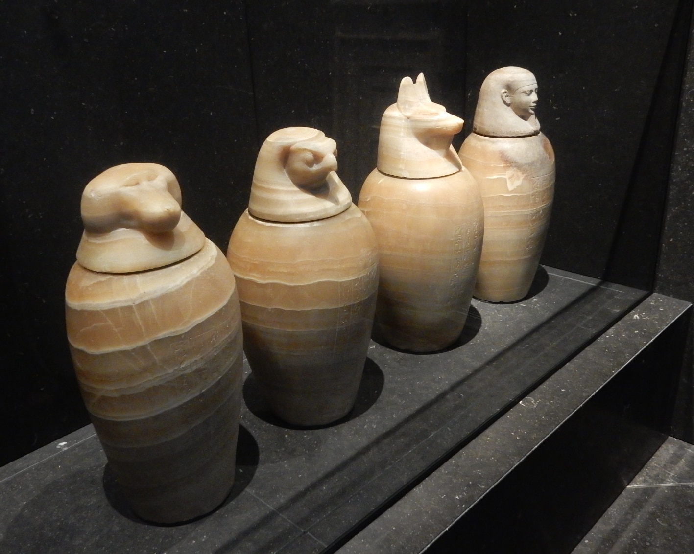 Four ancient Egyptian canopic jars with animal and human head lids, scented like Egypt perfume.