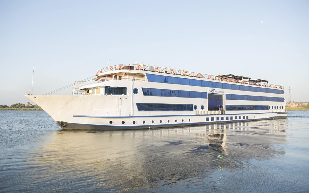 A large white and blue cruise ship offers 7 nights on the calm Nile with 12 free excursions.