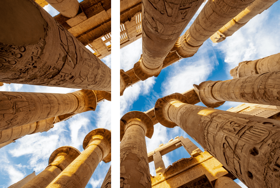 Majestic stone columns with hieroglyphics stretch into a sky brushed with clouds.