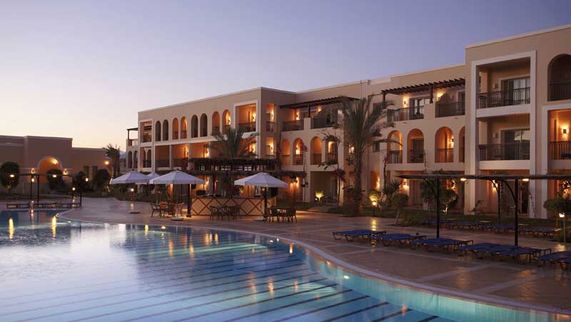 Jaz Mirabel Club offers balconies and a stunning pool at sunset.