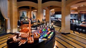 A buffet at Marriott Mena House with pastries, fruits, and vegetables on display.