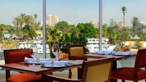 Sheraton Cairo Hotel & Casino: Dine with set tables, river views, and a palm-fringed cityscape.