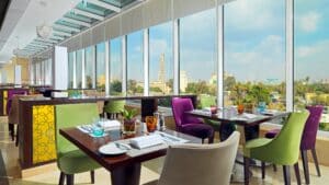 Sheraton Cairo Hotel: Dine amidst colorful chairs with a stunning city view.
