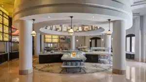 Luxurious buffet at Sheraton Miramar with modern decor and exquisite food displays.