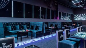 Blue velvet seating and ambient lighting set the tone at Sheraton Cairo Hotels modern lounge.