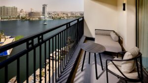 Balcony view at Sheraton Cairo Hotel & Casino overlooking the river and city buildings.