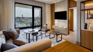 Modern living room with river view, TV, seating area at Sheraton Cairo Hotel & Casino.