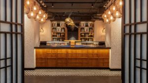 Sushi bar with wooden counter, hanging lights, and decorative fish at Sheraton Cairo.