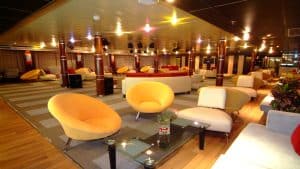 Spacious lounge with MS Classic Blue Shadow IV 5* seating and soft lighting.