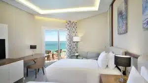 Hilton Hurghada room with ocean view, balcony, and modern furnishings.
