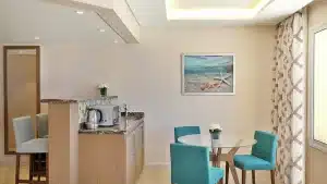 Modern Hilton Hurghada kitchen with turquoise chairs and minimalist decor.