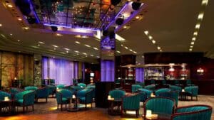 Teal-chaired lounge at Hurghada Marriott with dim lighting and a back bar.