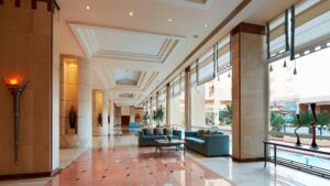 Hotel lobby at Hurghada Marriott with large windows and decorative lighting.