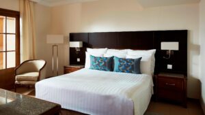 Room at Hurghada Marriott with a neat bed, two pillows, and bedside tables with lamps.