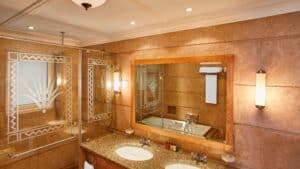 Sheraton Soma Bay luxury bathroom with dual sinks and a glass-enclosed shower.