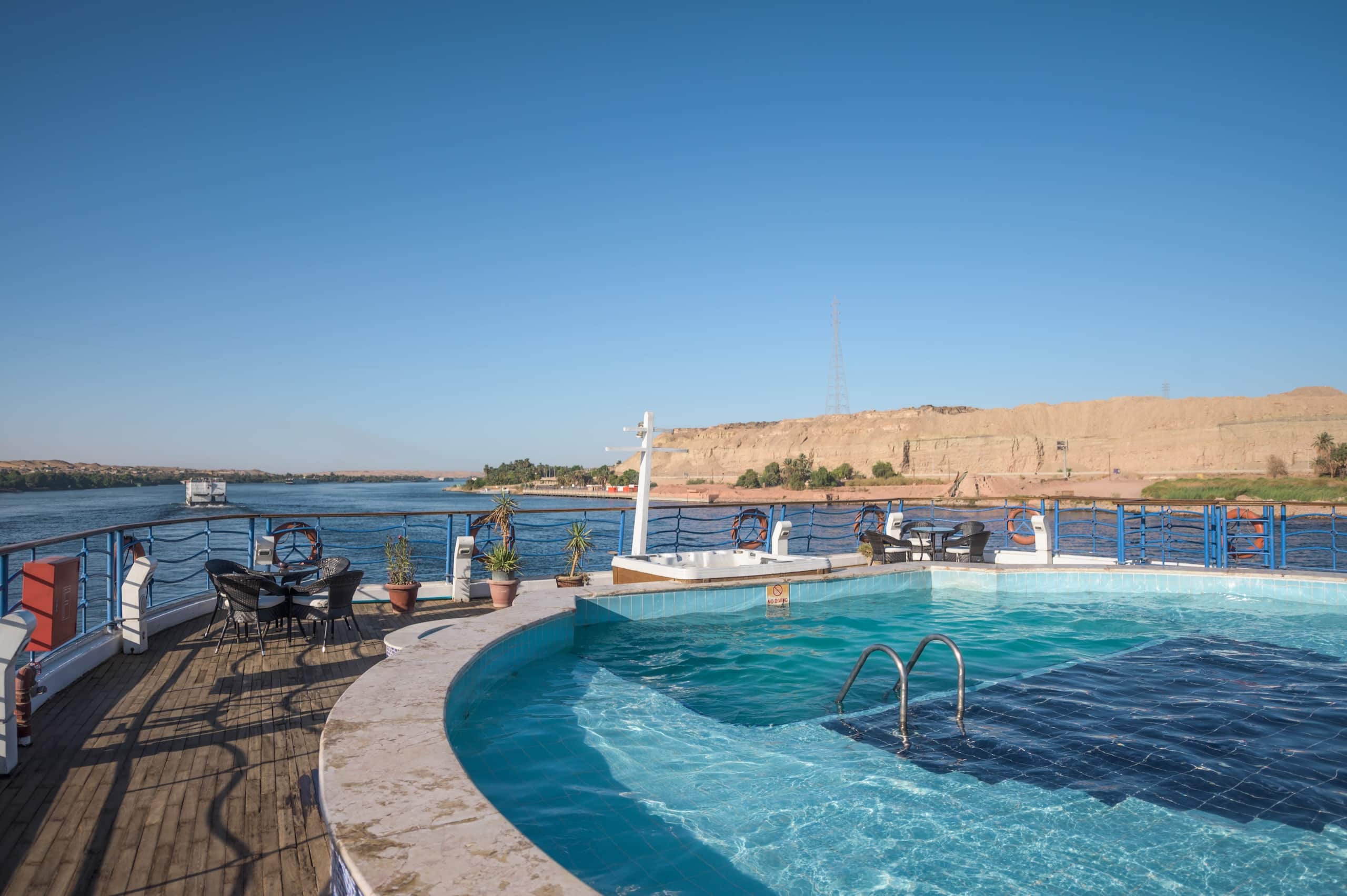 MS Royal Princess cruise features a pool deck with stunning desert landscapes in the background.