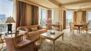 Luxurious living room at Four Seasons with elegant furniture and cityscape views.