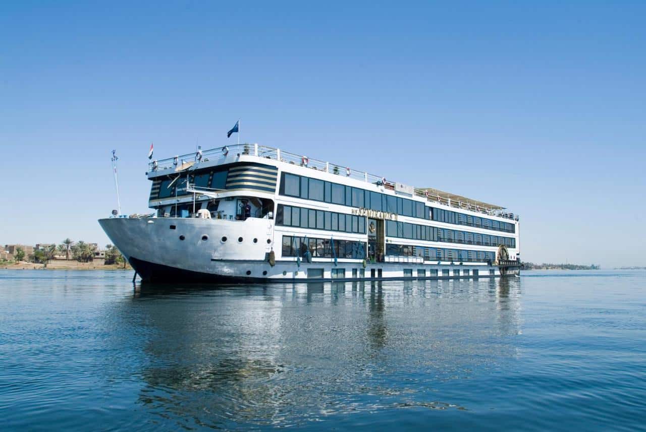 MS Classic Semiramis II glides on calm water under a clear blue sky.