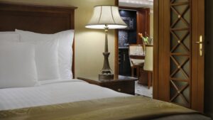 A cozy room at Cairo Marriott Hotel with a view of the dining area through the door.