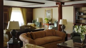 Elegant living room at Cairo Marriott Hotel, with sofas, soft lighting, and wooden accents.