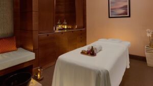 The Nile Ritz-Carlton massage room with a treatment table and soft lighting.