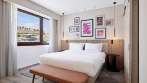 Modern Hyatt Centric Cairo West room with a double bed, stylish art, and a large window.