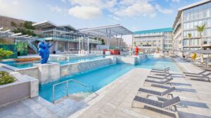 Modern Hyatt Centric Cairo West pool area with lounge chairs and colorful bear statues.
